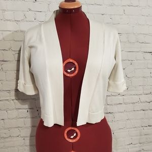 White shrug with button detail